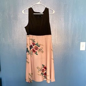 Sleeveless dress with floral skirt